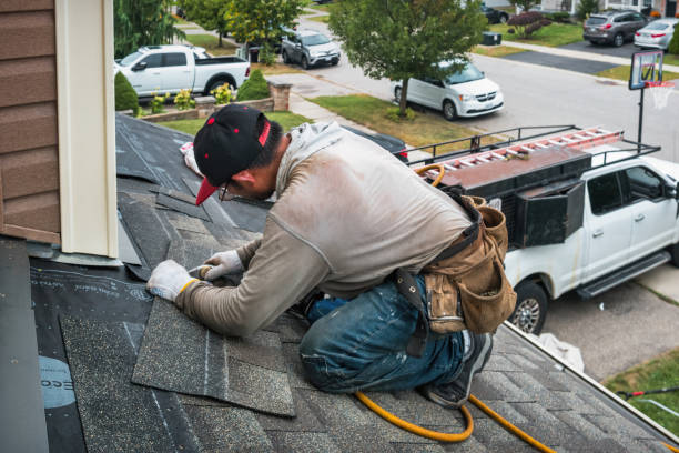 Professional Roof Replacement technician working in Corolla, NC